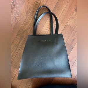 Black geometric Donna Karan pebble leather tote purse. expandable storage. New.